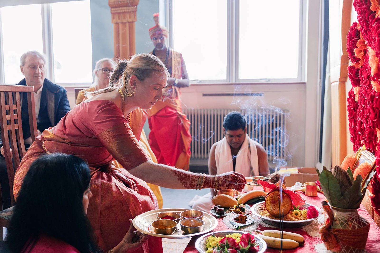 Family gathered around a colorful wedding ceremony