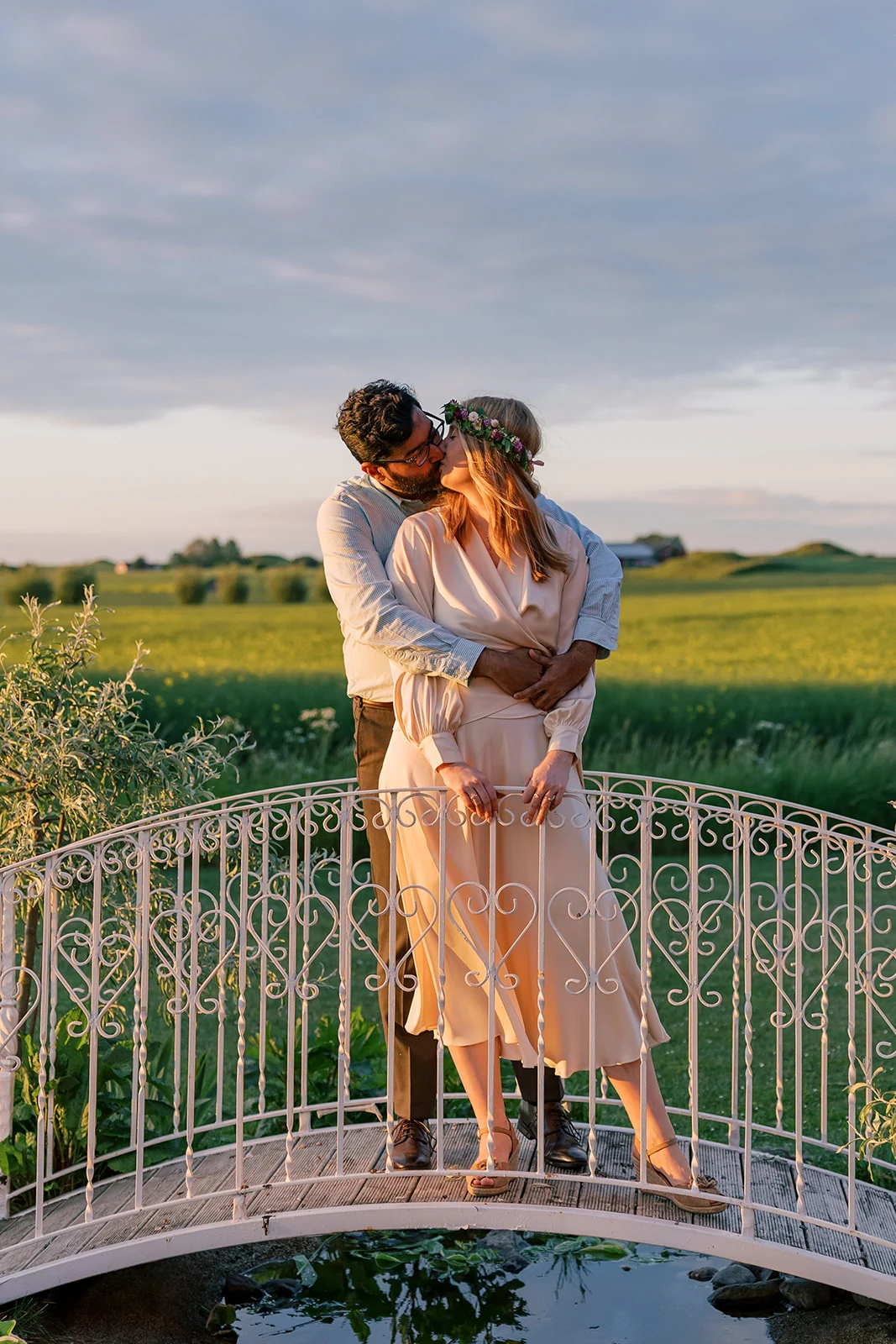 A couple embracing on a terrace in the evening light
